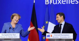 merkel_sarkozy_risate.jpg_415368877