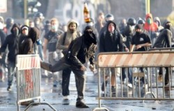 A demonstrator throws a bottle during a demonstration of the 'Indignant' group in Rome October 15, 2011. Protesters worldwide geared up for a cry of rage on Saturday against bankers, financiers and politicians they accuse of ruining global economies and condemning millions to poverty and hardship through greed. They plan to take to the streets from Sydney to Alaska via London, Frankfurt, Washington and New York. REUTERS/Remo Casilli(ITALY - Tags: POLITICS CIVIL UNREST BUSINESS TPX IMAGES OF THE DAY)